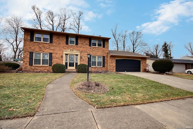 colonial inspired home with a garage, a front lawn, concrete driveway, and brick siding