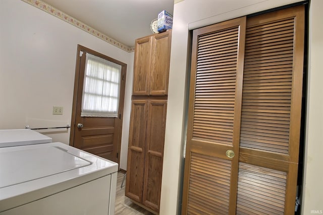 laundry area featuring cabinet space and washing machine and dryer