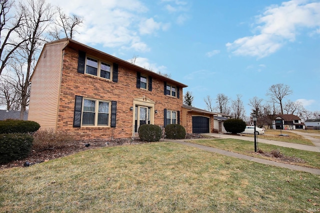 colonial inspired home featuring an attached garage, a front yard, concrete driveway, and brick siding