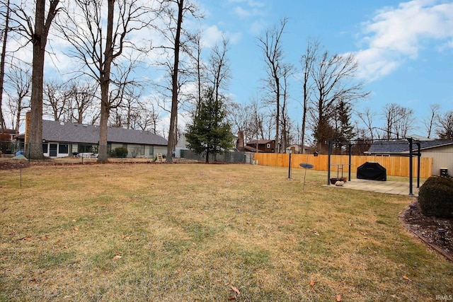 view of yard featuring a patio area and a fenced backyard