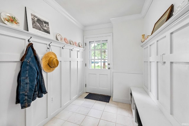 mudroom with ornamental molding and light tile patterned floors