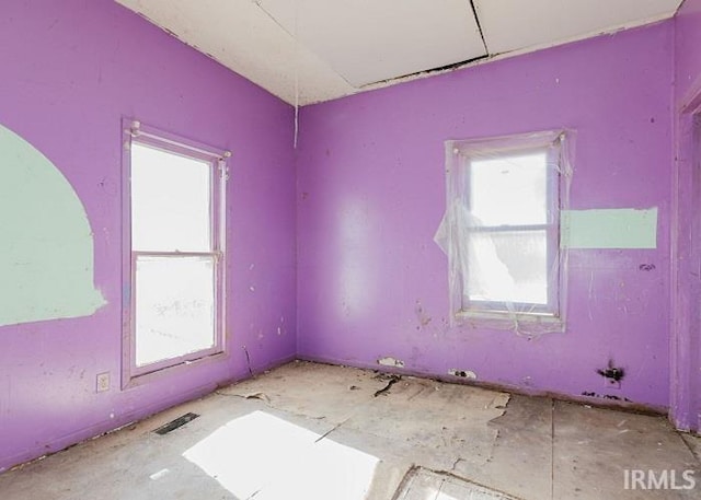 empty room featuring plenty of natural light