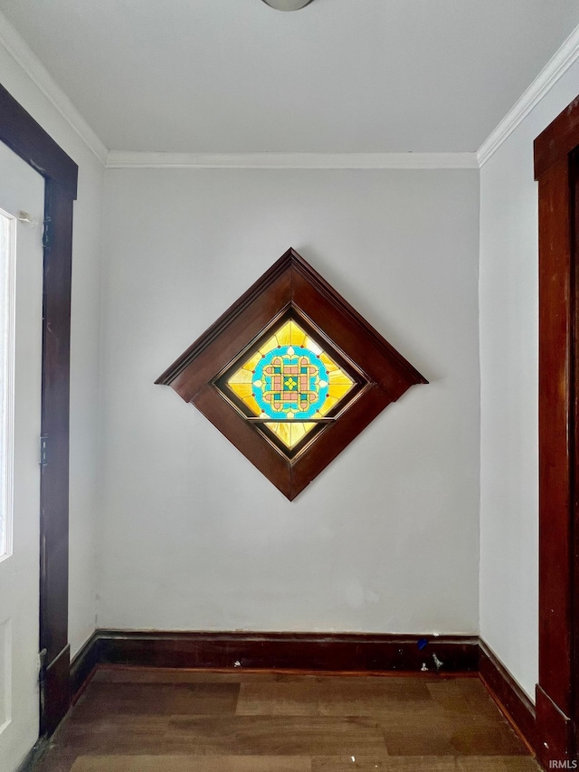 details featuring baseboards, wood finished floors, and ornamental molding