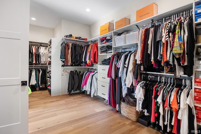 walk in closet featuring light wood-style floors