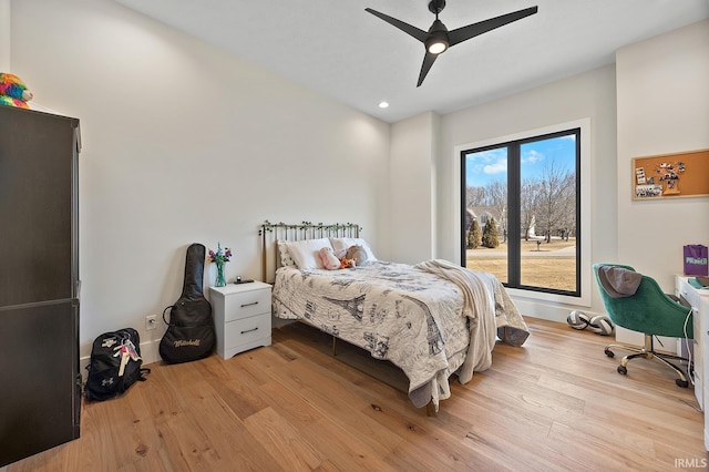 bedroom with a ceiling fan, light wood-type flooring, and recessed lighting