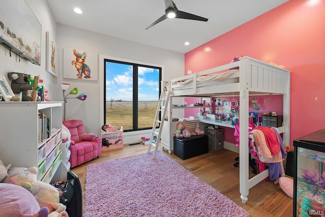 bedroom with recessed lighting, ceiling fan, and wood finished floors