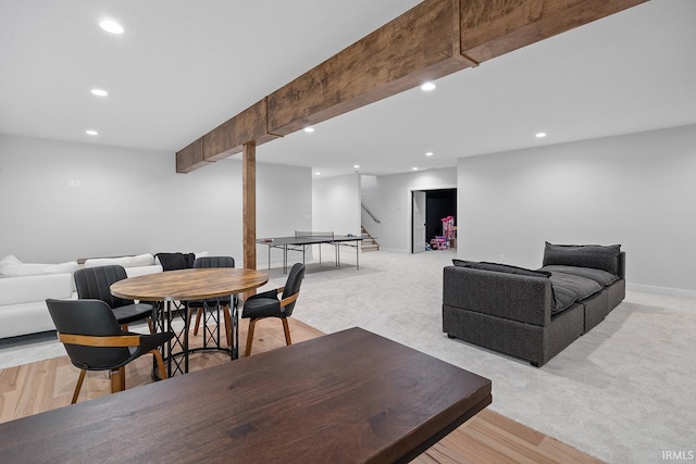 living room with light carpet, baseboards, beamed ceiling, and recessed lighting