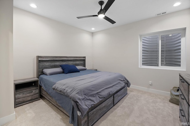 bedroom featuring recessed lighting, light colored carpet, visible vents, and baseboards