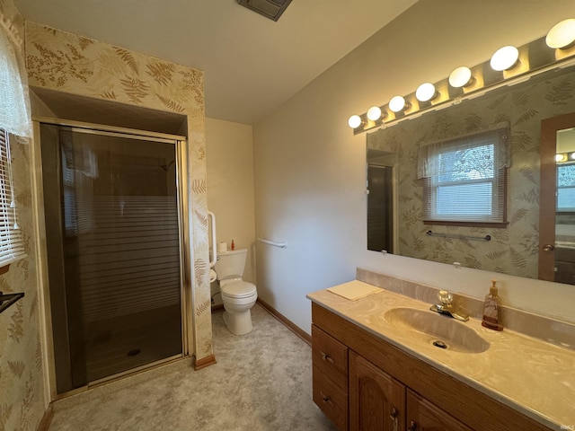 bathroom with toilet, a shower stall, vanity, and wallpapered walls