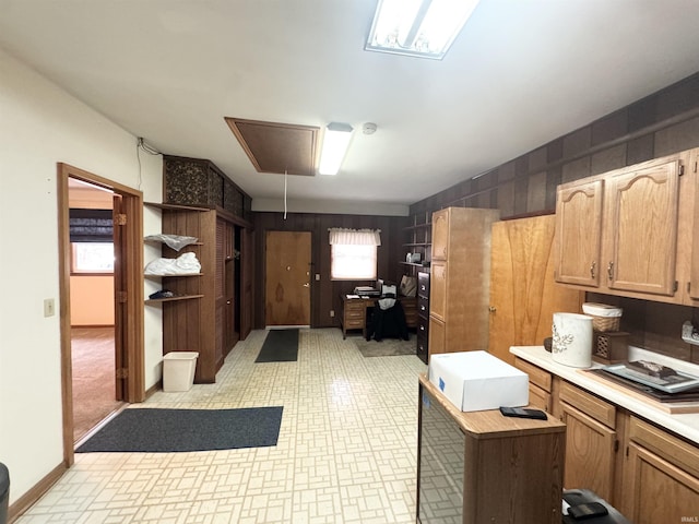 kitchen featuring baseboards and light countertops