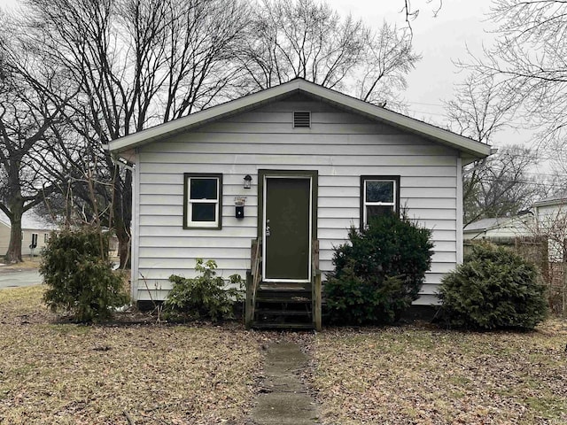 bungalow-style house featuring entry steps