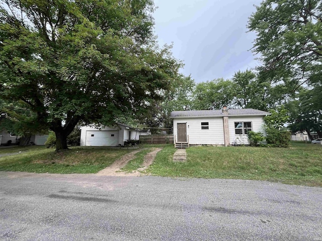 view of front of property with driveway, fence, and entry steps