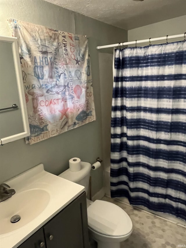 full bathroom with a shower with shower curtain, toilet, vanity, and a textured ceiling