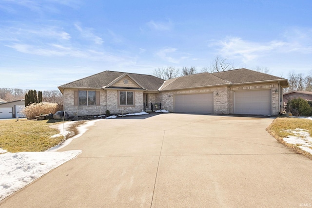 view of front facade with driveway, a shingled roof, and an attached garage