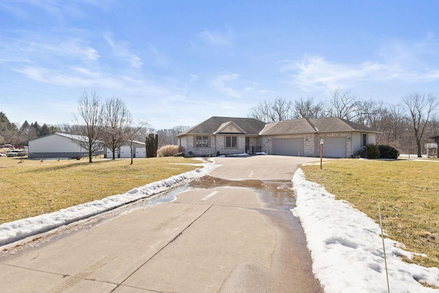 view of front of home featuring a garage, stone siding, driveway, and a front lawn