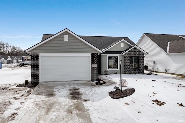 single story home featuring an attached garage, concrete driveway, and brick siding