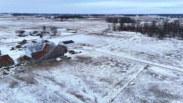 snowy aerial view featuring a rural view