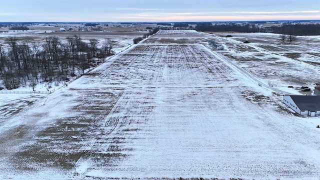 snowy aerial view with a rural view