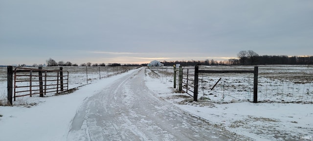 exterior space with a rural view and fence