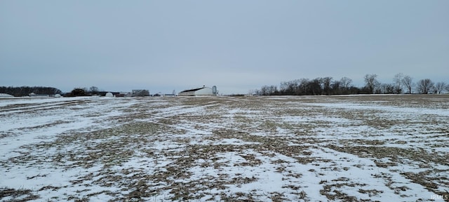 view of yard layered in snow