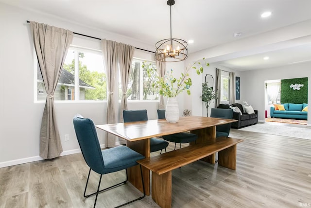 dining space featuring baseboards, recessed lighting, and light wood-style floors