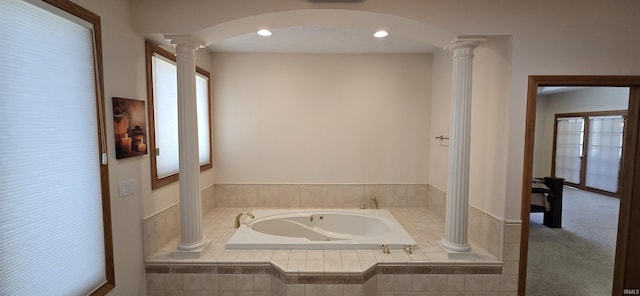 full bathroom featuring recessed lighting, a garden tub, and ornate columns