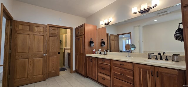 full bathroom with double vanity, a sink, visible vents, and decorative columns