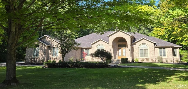 ranch-style home with a front yard