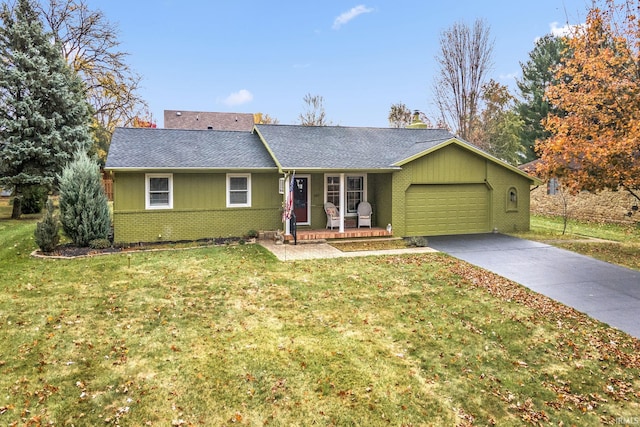 ranch-style home featuring an attached garage, brick siding, concrete driveway, a front lawn, and a chimney