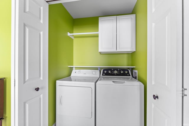 laundry area with cabinet space and washing machine and dryer