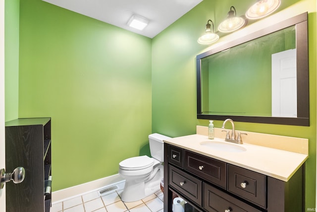 half bath with tile patterned flooring, toilet, visible vents, vanity, and baseboards