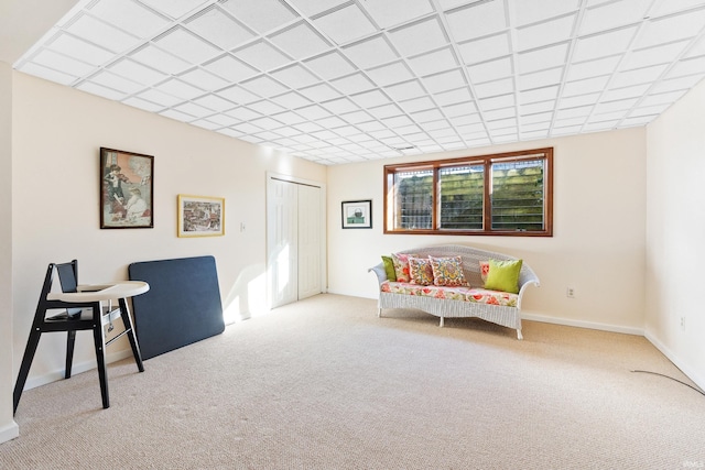 sitting room with carpet and baseboards