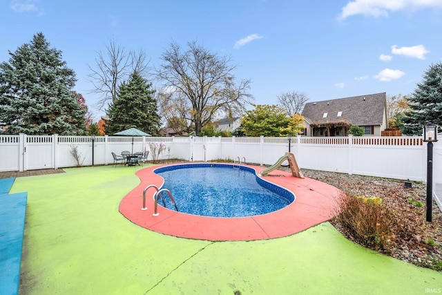 view of swimming pool with a fenced in pool and a fenced backyard