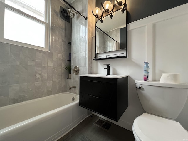 full bathroom featuring a chandelier, toilet, vanity, visible vents, and  shower combination