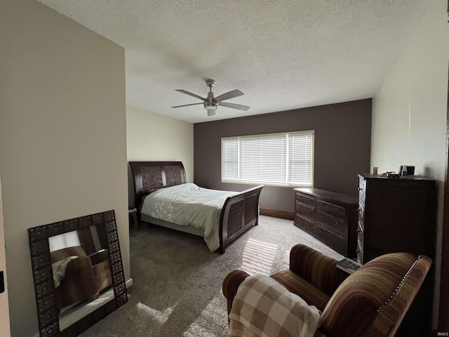 bedroom with carpet, a textured ceiling, and a ceiling fan