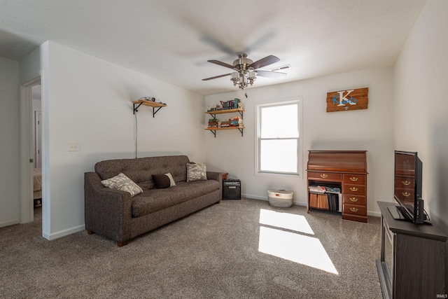 carpeted living area with visible vents, ceiling fan, and baseboards