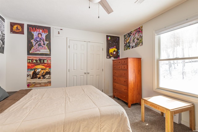 carpeted bedroom featuring a closet and ceiling fan