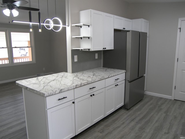 kitchen with dark wood-style floors, white cabinetry, baseboards, and open shelves