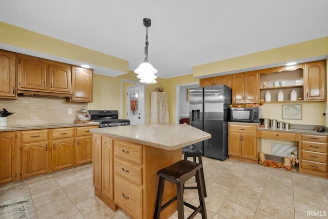 kitchen with black microwave, light countertops, stove, and stainless steel refrigerator with ice dispenser