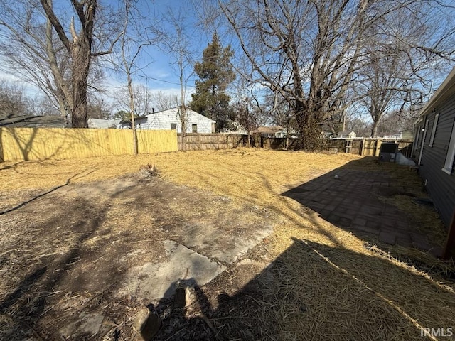 view of yard with a fenced backyard