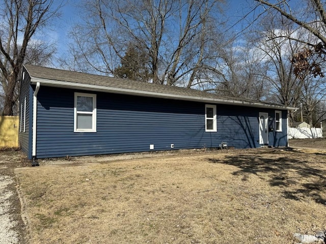 view of home's exterior with a lawn