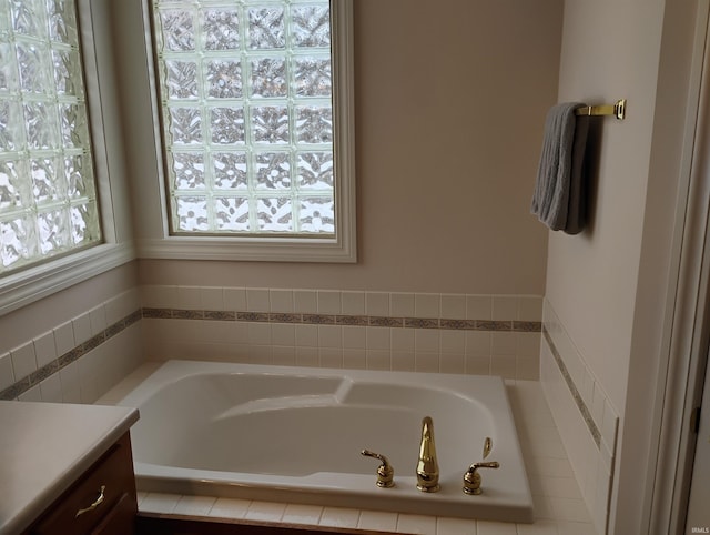 bathroom with a bath and vanity