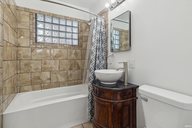 bathroom with toilet, shower / tub combo, tile patterned floors, and vanity