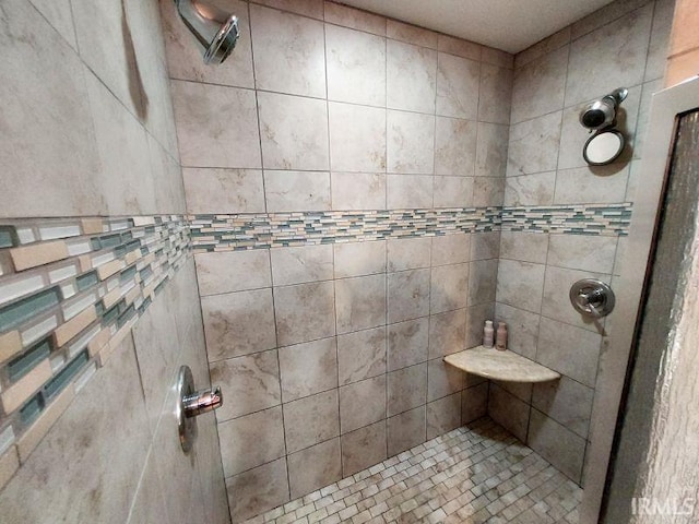 full bathroom with a tile shower