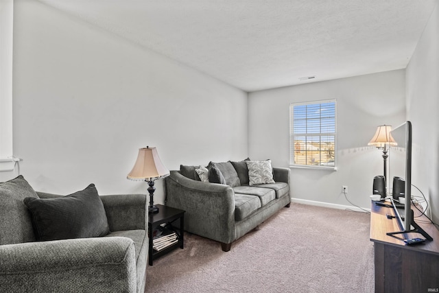 carpeted living room with visible vents, baseboards, and a textured ceiling