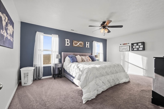 bedroom featuring carpet, visible vents, ceiling fan, and baseboards