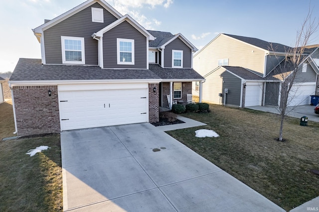 traditional-style home with driveway, brick siding, a front lawn, and an attached garage