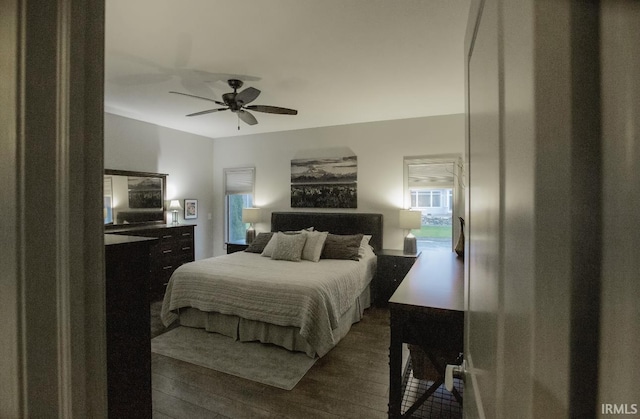 bedroom featuring dark wood-type flooring and ceiling fan