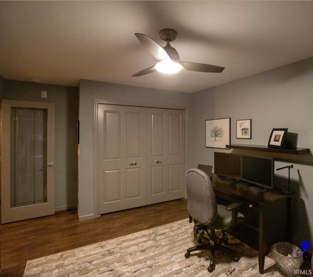 office with a ceiling fan and wood finished floors