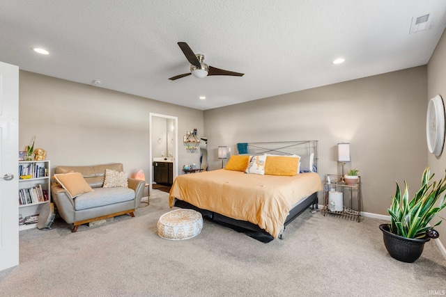 bedroom with carpet floors, recessed lighting, visible vents, and ensuite bathroom